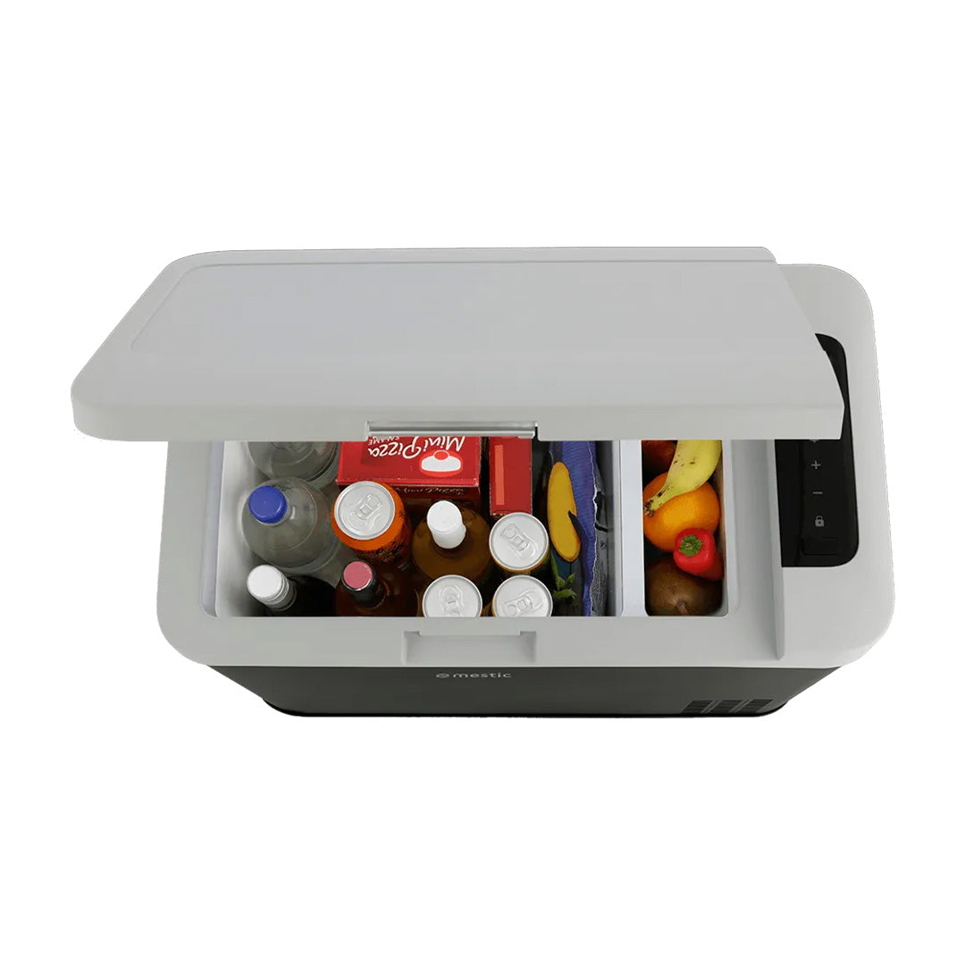 Top view of Mestic MCC-35 cool box packed with bottles food and frozen items