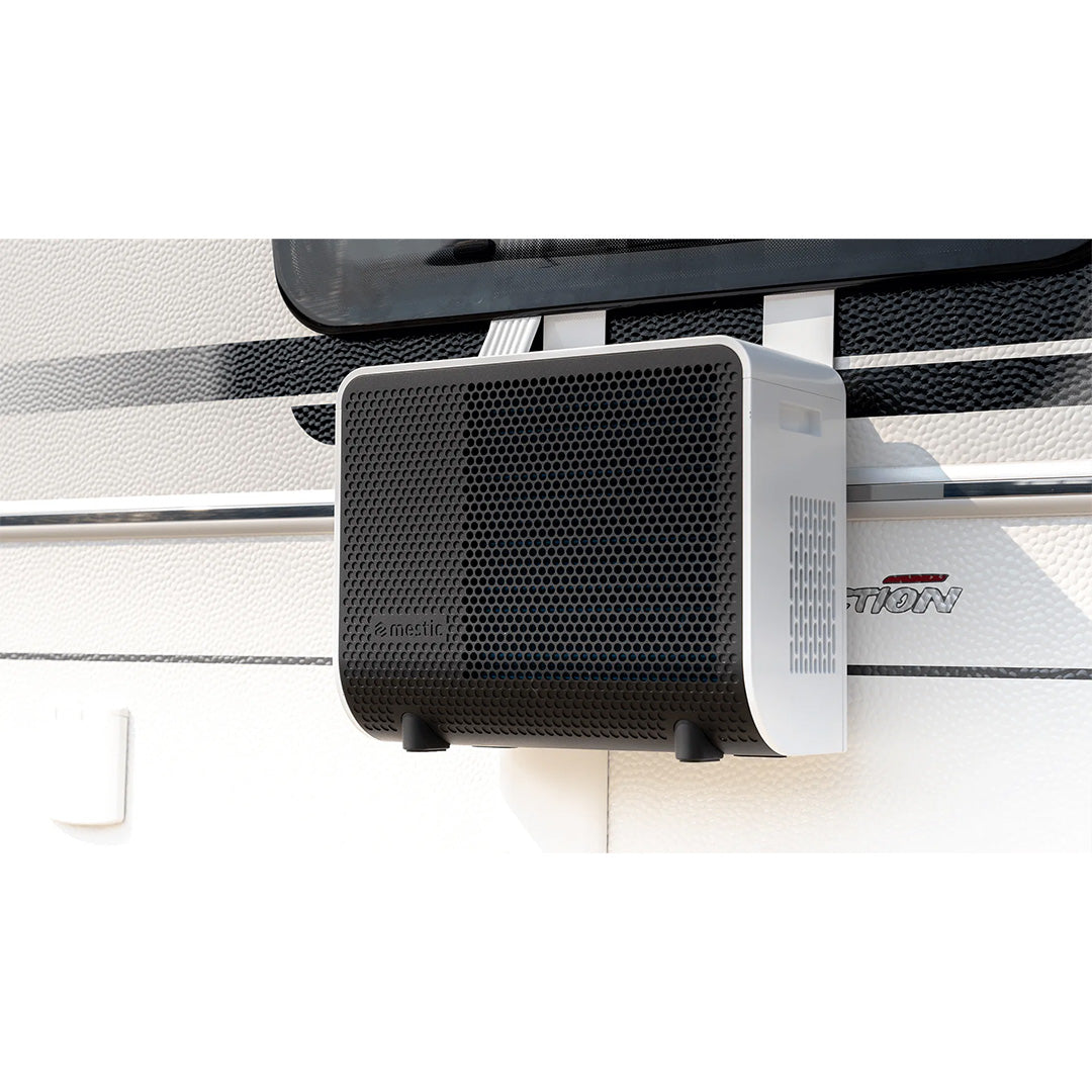 Mestic SPA-3100 split air conditioning outdoor unit mounted on the exterior of a caravan